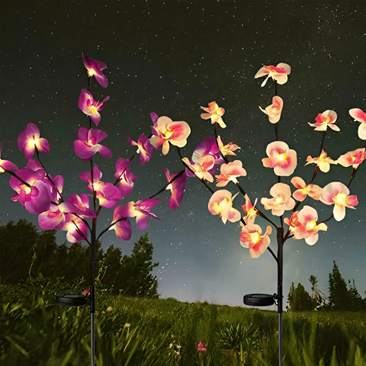 LED Solar Orchid Lights with Color Transition in Pink and Purple, illuminating a garden with vibrant, lifelike flower designs against a natural outdoor backdrop.