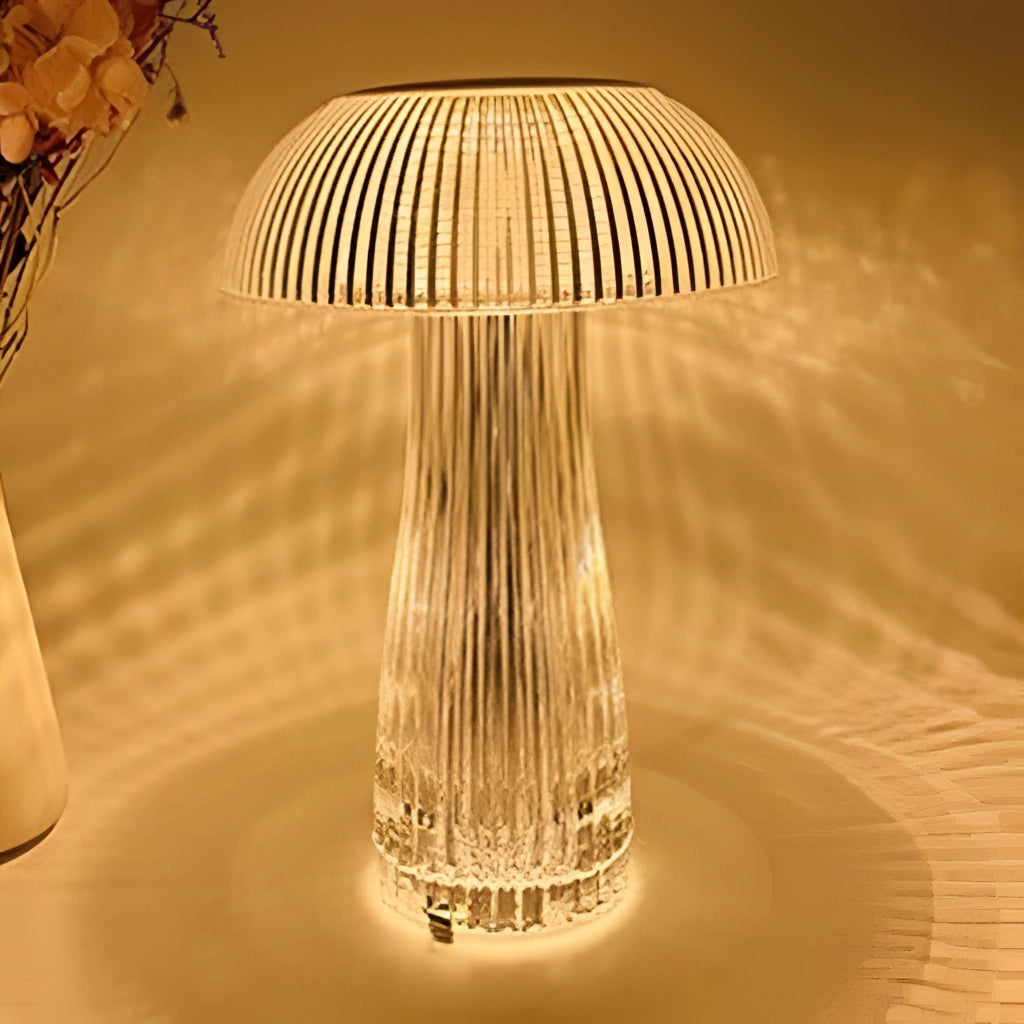 LED Table Lamp with Steepless Dimming and Large Battery on a wooden table beside a glass of water, with a backdrop featuring modern art and a tree.