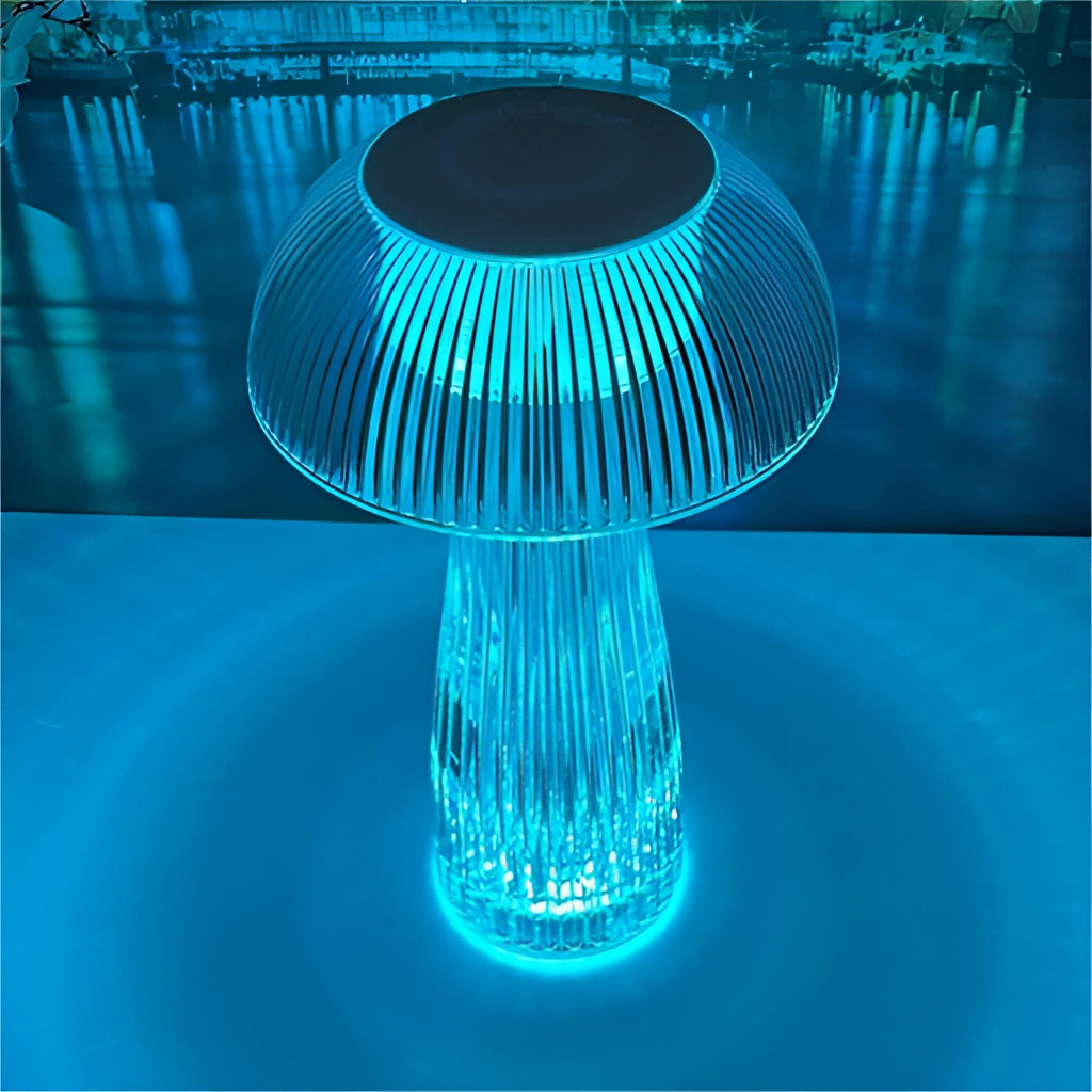 LED Table Lamp with Steepless Dimming and Large Battery on a table with blue and aqua accents in the background.