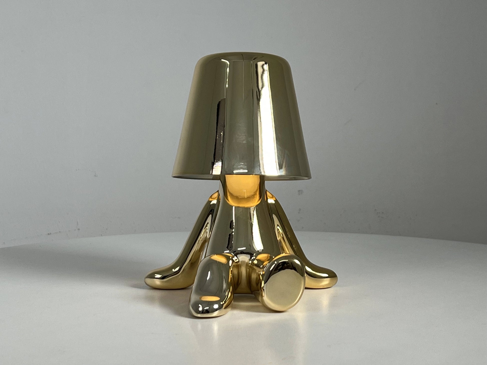 LED Table Lamp with unique cylindrical design, featuring a metal and aluminium lampshade with bronze accents, perfect as a fashionable light fixture for any modern space.