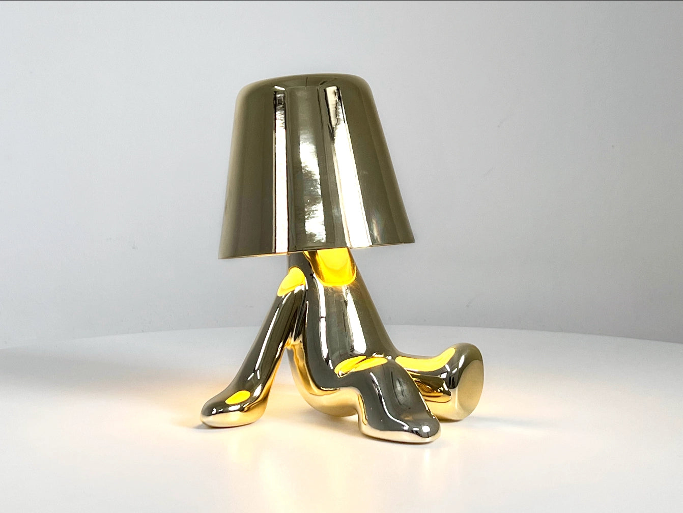 LED table lamp with unique design and high quality featuring sleek legs on a modern table.