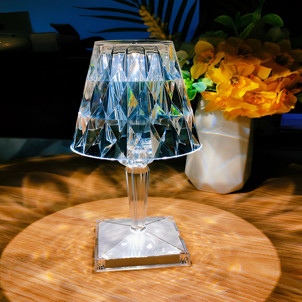 LED Touch Table Lamp with USB Charging on a table next to a blue drinkware set and a plant, providing ambient mood lighting.