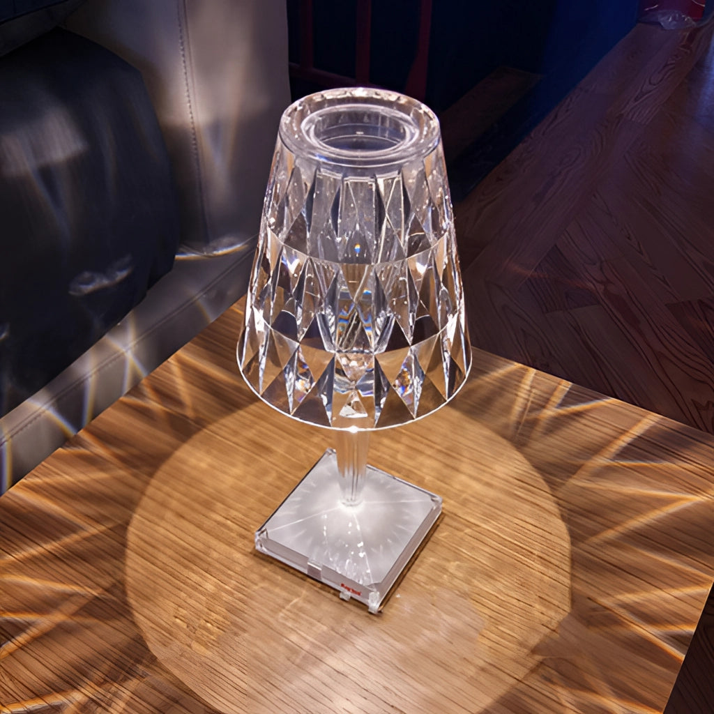 LED Touch Table Lamp with USB Charging placed on a wooden table surrounded by tableware and drinkware.