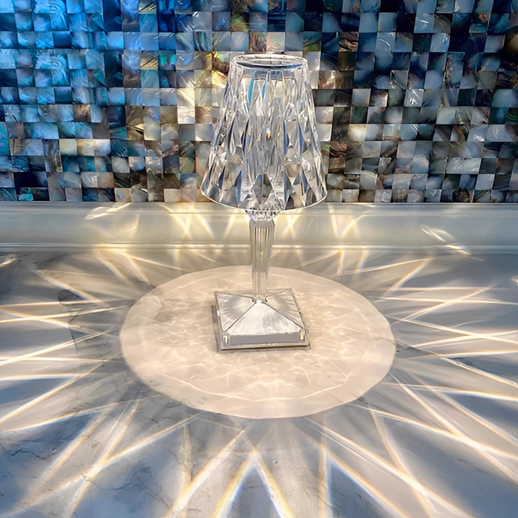 LED touch table lamp with USB charging; blue lighting effect; unique, symmetrical design; water and glass elements; circular artistic features.