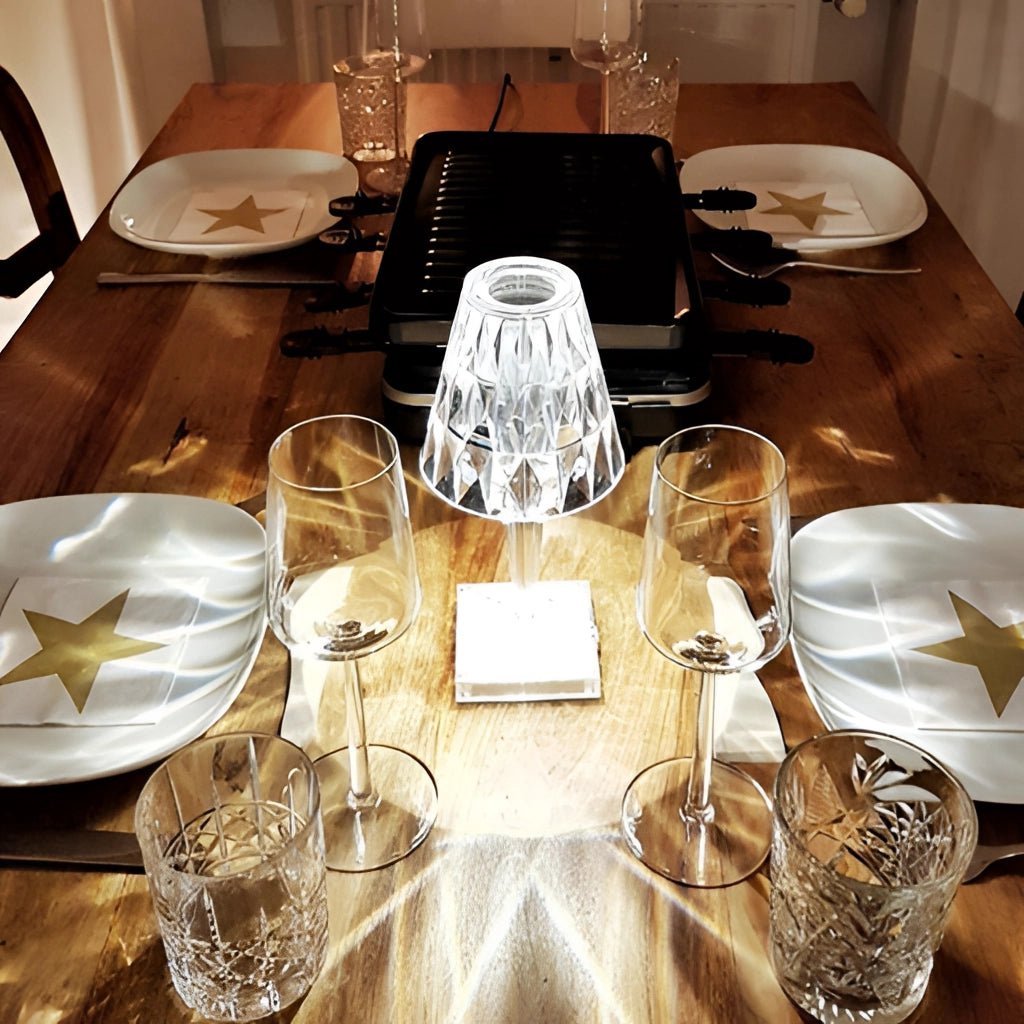 LED Touch Table Lamp on a white table with USB charging port, surrounded by tableware and a chair in the background.