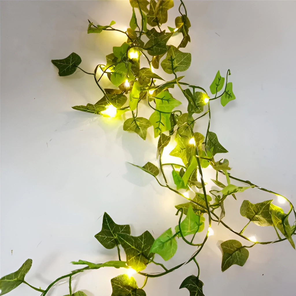 LED Vine Garden String Lights with Ivy Vines - 32ft 100 LEDs, featuring two-color ivy vines, illuminated and intertwined with lush greenery.