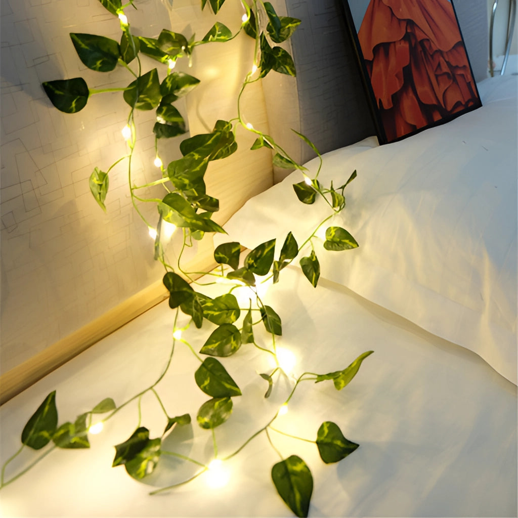 LED vine garden string lights with ivy vines, 32ft with 100 green dill LEDs, wrapped around a room, creating a pattern with an artistic touch.