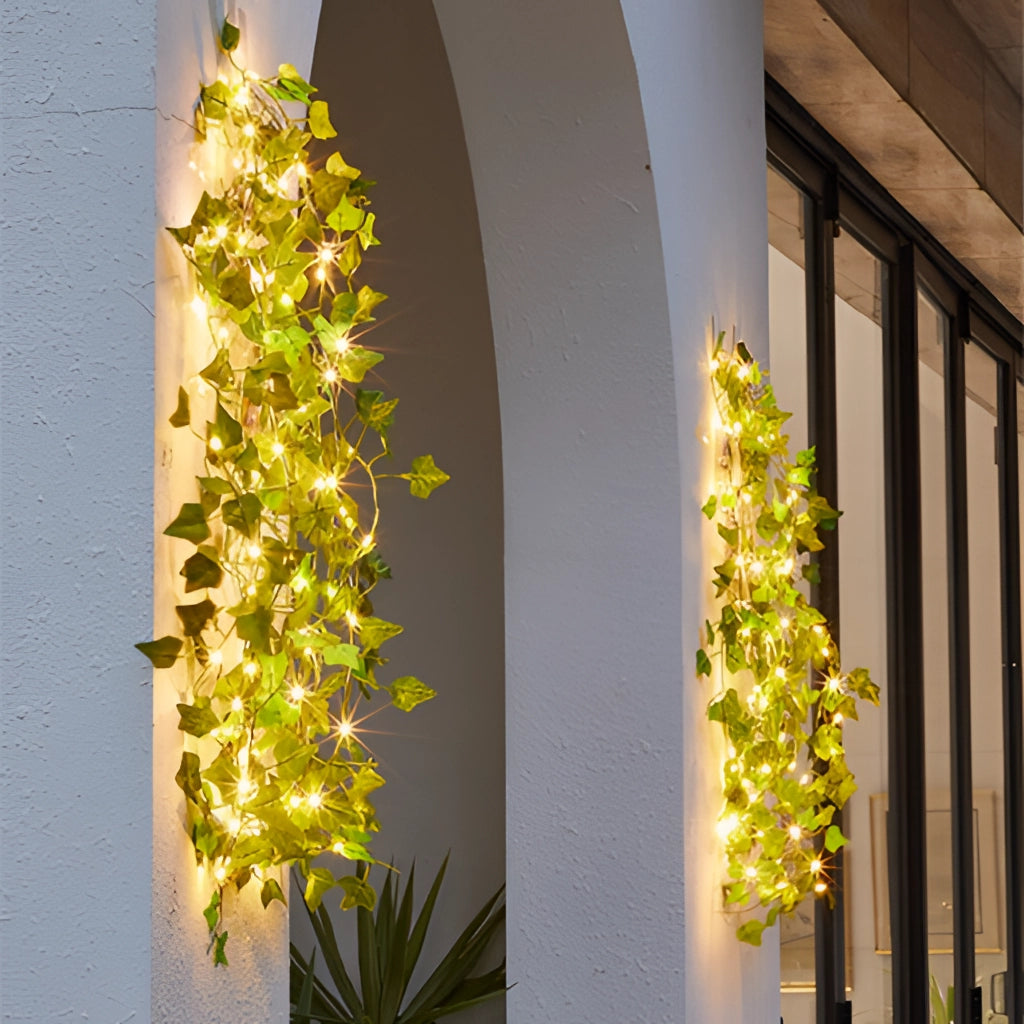 LED vine garden string lights with ivy vines, 32ft 100 LEDs, featuring lush green leaves and gold-hued lighting for interior design.
