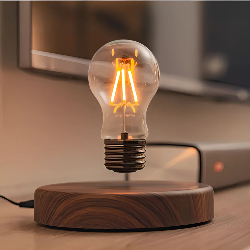 Levitating LED desk lamp with walnut base, featuring a warm amber glow.