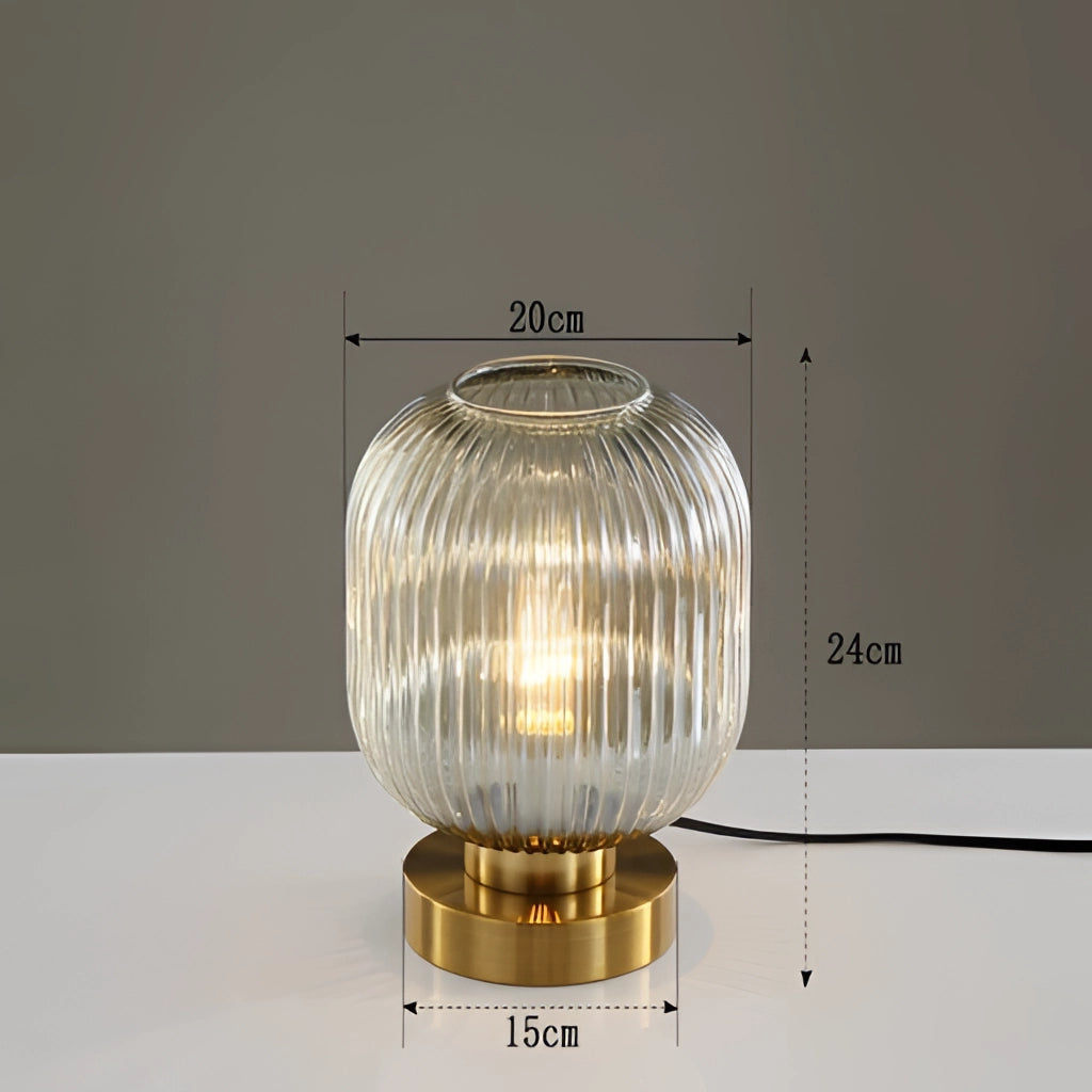 Luminescent Crystal Table Lamp in Bernstein, 20cm, with a rectangular base and intricate crystal design, emitting a warm, glowing light.
