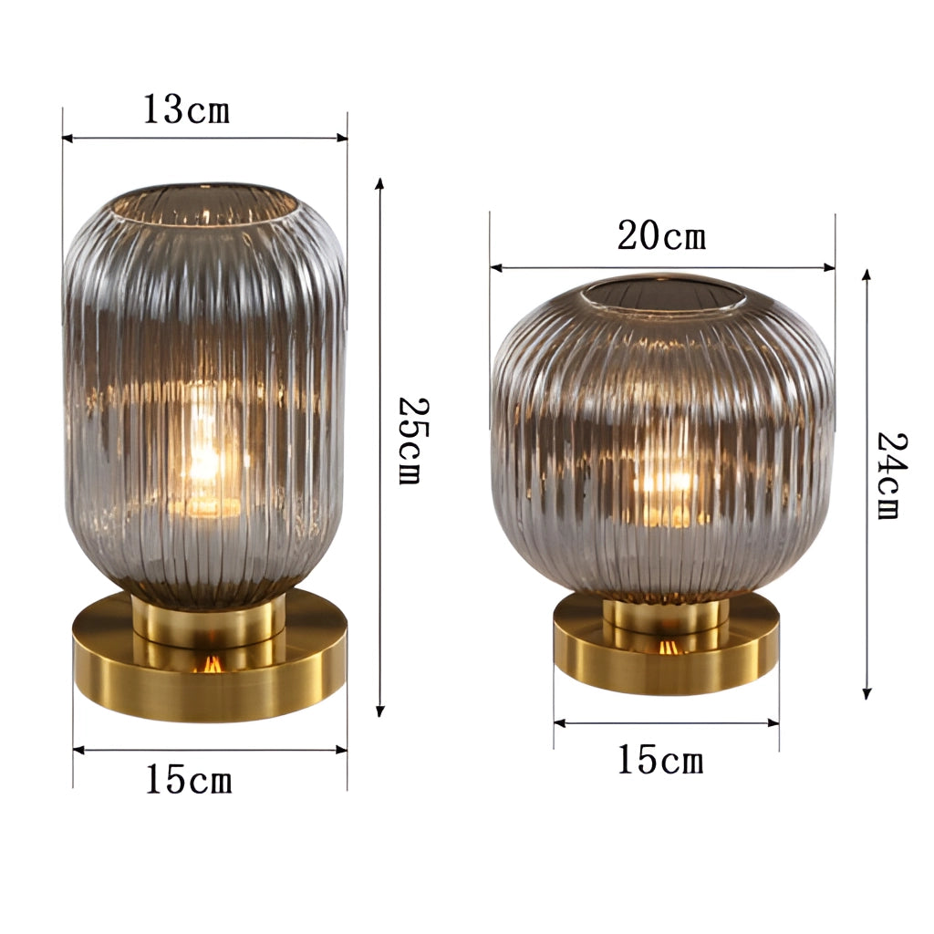 Luminescent crystal table lamp with a sleek metal base and a glowing crystal design, placed on a modern table.