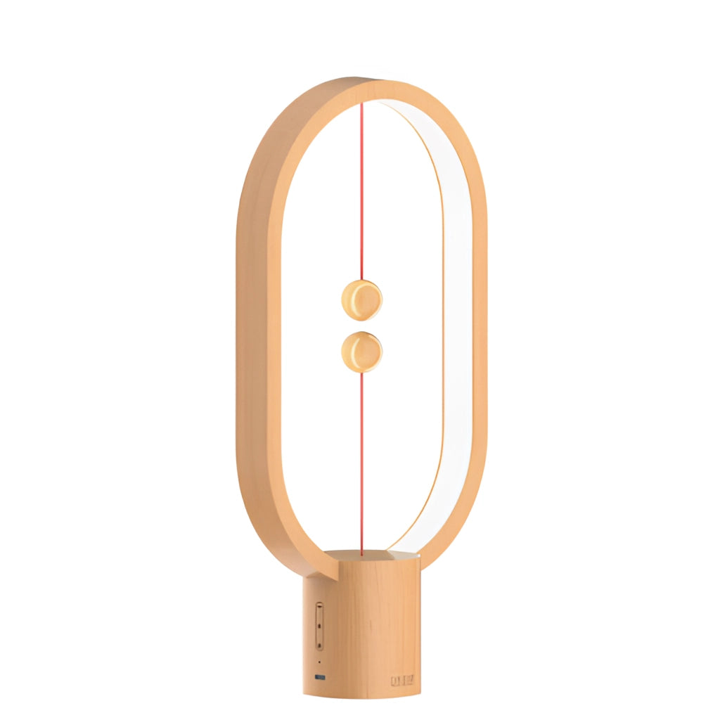 Magnetic Balance Table Lamp with LED lighting, featuring a wooden finish, on a wooden surface.