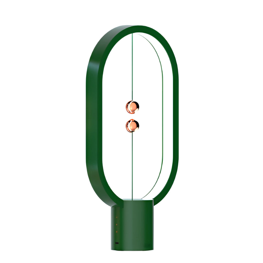 A green magnetic balance table lamp with LED lighting, featuring a modern artistic design and circular components.