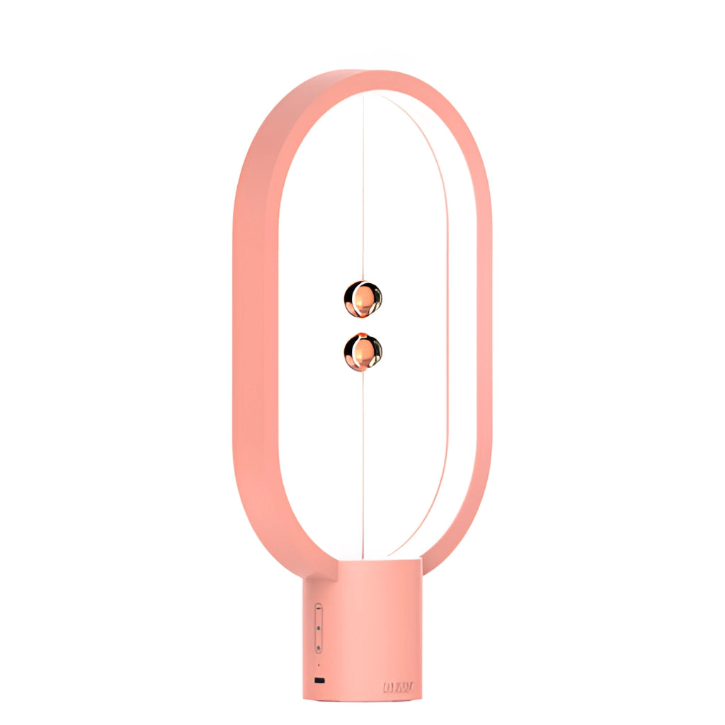 A Rosa variant of the Magnetic Balance Table Lamp with LED Lighting, featuring a sleek rectangular design, magenta accents, and a balancing mechanism with circular elements.