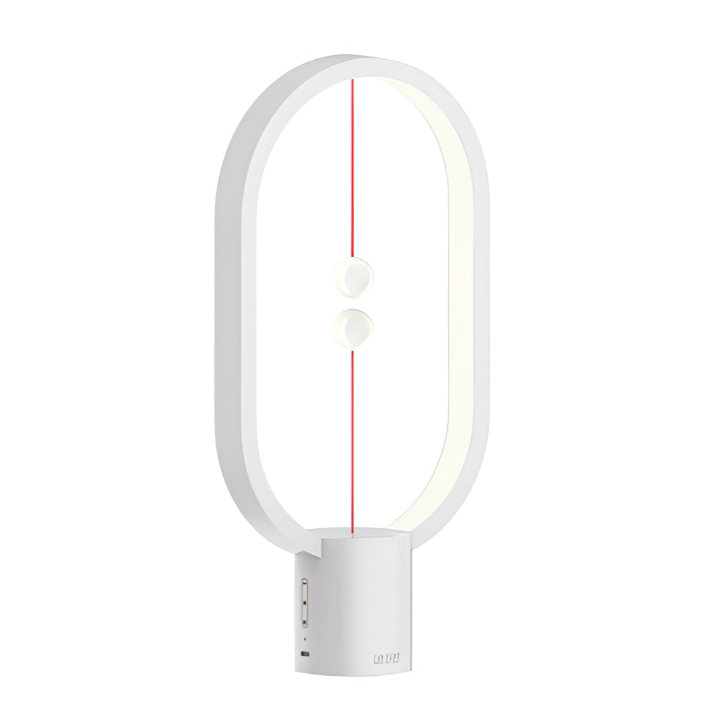 White Magnetic Balance Table Lamp with LED Lighting on a table.