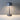 Dark gray metal table lamp with adjustable brightness and circular lampshade.