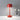 Red Metal Table Lamp with Adjustable Brightness, featuring a sleek rectangular base and a matching red lampshade, situated on a table in a modern interior setting.