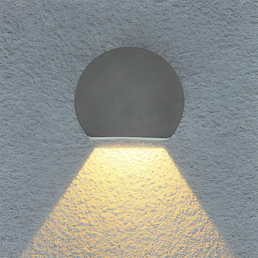 Metal wall lamp LED sconce in sand black/grey with aluminum borosilicate glass, featuring a circular design pattern and symmetrical layout, emitting electric blue light.