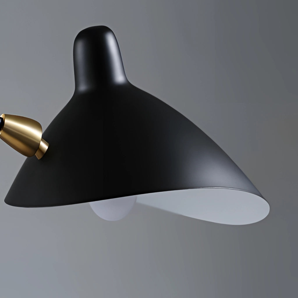 Midcentury floor lamp with tilting heads featuring a sleek metal and glass design, standing in a modern bedroom setting.
