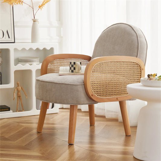 Modern club chair in orange, showcased in a stylish dining or bedroom setting with wooden table and flooring, enhanced by interior lighting.