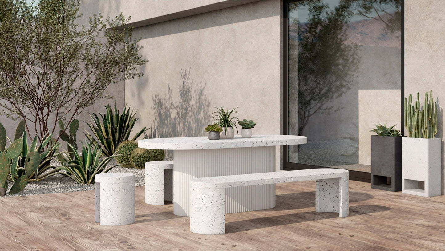 Modular ivory terrazzo garden planter with a rectangular shape, placed on a wooden table in an outdoor setting.