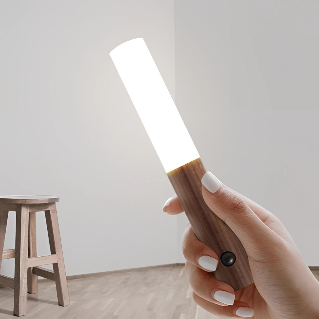 Motion Sensor LED Rechargeable Night Light with Wooden Design, featuring a sleek wood finish, placed on a wooden surface.