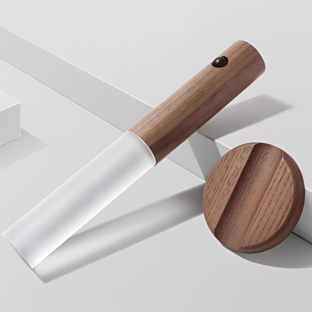 Motion Sensor LED Rechargeable Night Light with Wooden Design placed on a wooden surface.