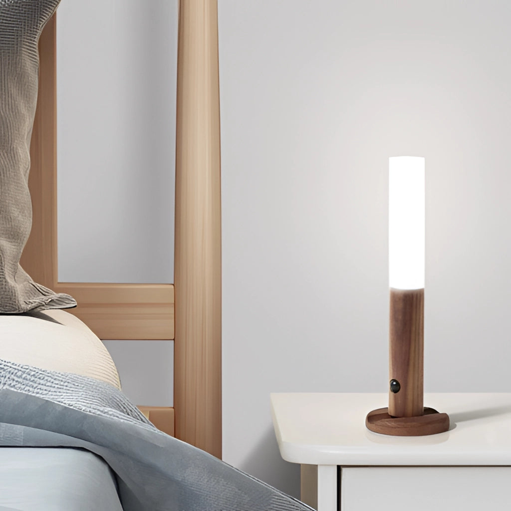 Motion Sensor LED Rechargeable Night Light with Wooden Design placed on a wooden surface, showcasing its rectangular shape and sleek, modern aesthetic.
