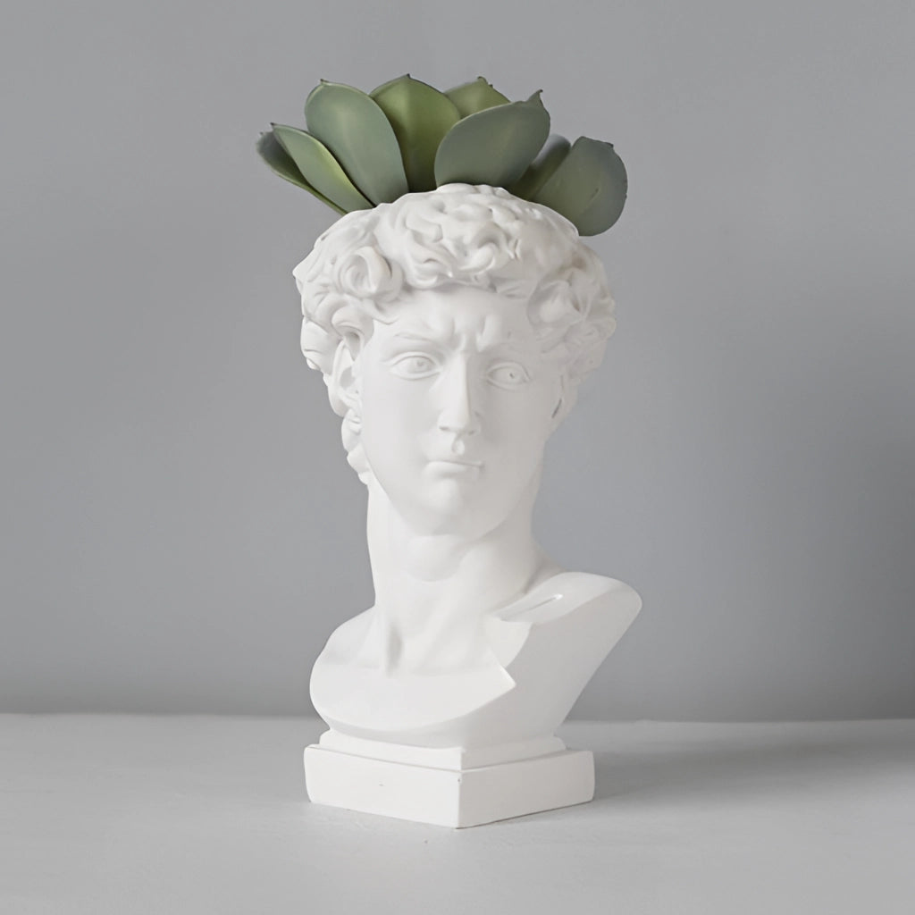 Neoclassical Greek head resin vases and planters resembling ancient sculptures with intricate carvings and artistic detailing.