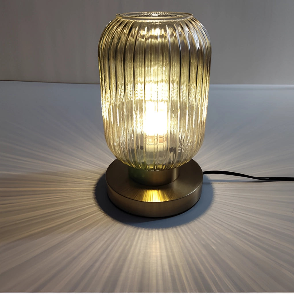 Nordic Amber Table Lamp with stained glass shade on a wooden table, featuring intricate stained glass art and warm amber light.