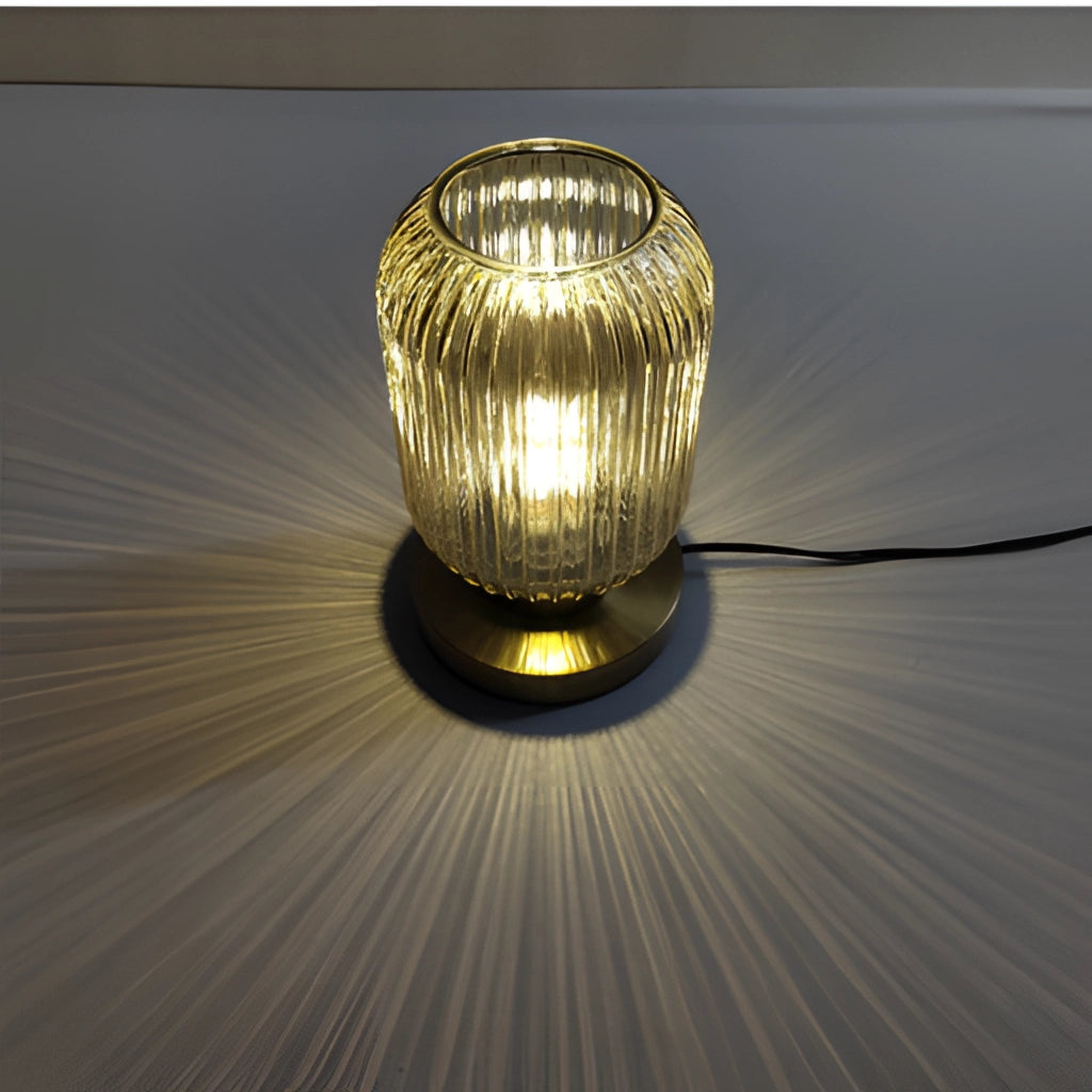 Nordic Amber Table Lamp with Stained Glass Shade, featuring a rectangular stained glass shade in amber tones, a sleek lamp base, and a warm glow from the light bulb inside.