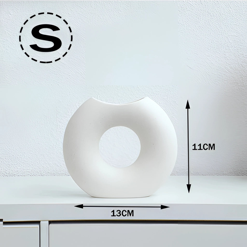 Nordic Style Ceramic Donut Vase in white, small size, with a modern circular design displayed on an office desk.