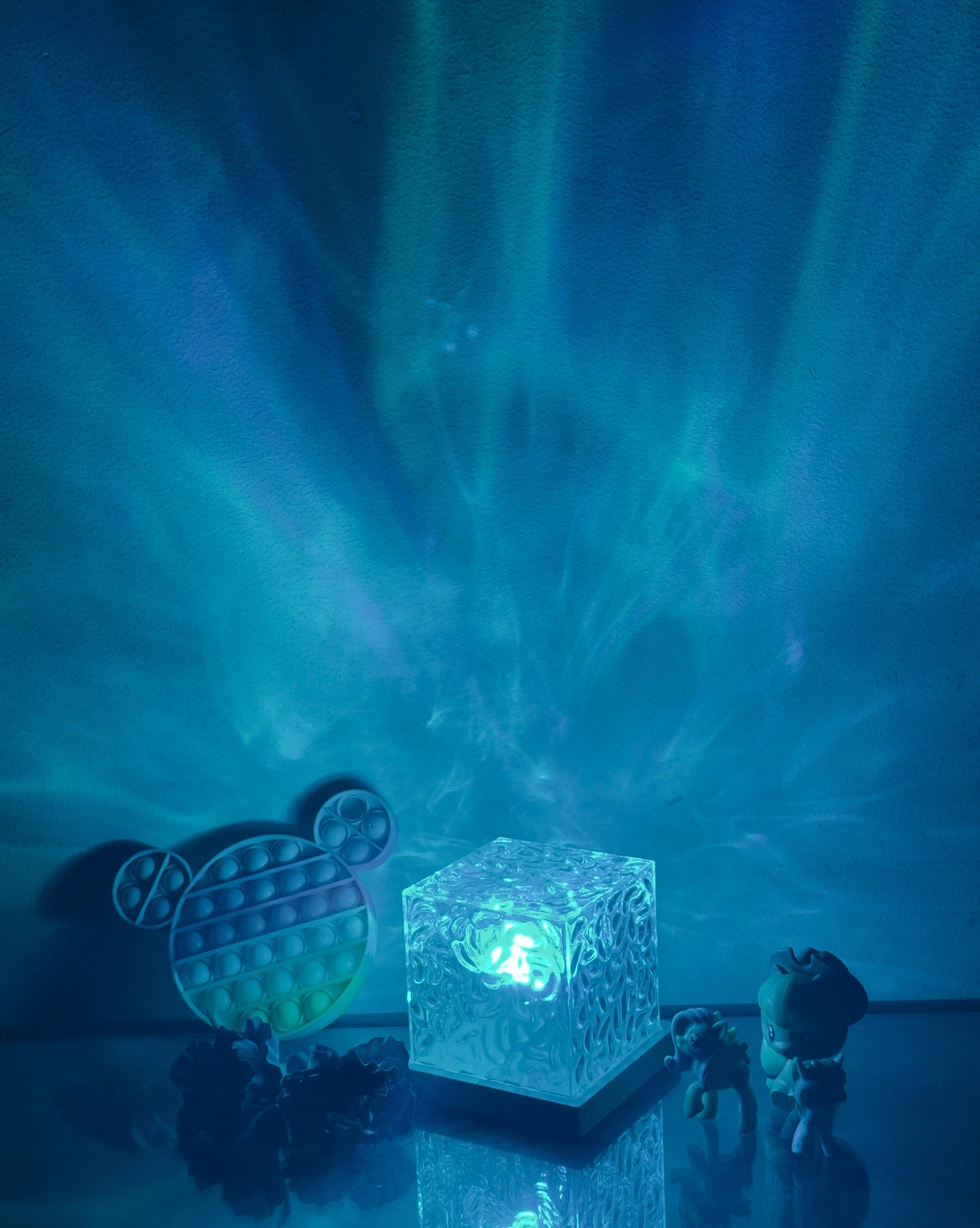 Northern Lights Inspired Cube Lamp with shades of blue and aqua, featuring artistic design elements reminiscent of the sky and water.