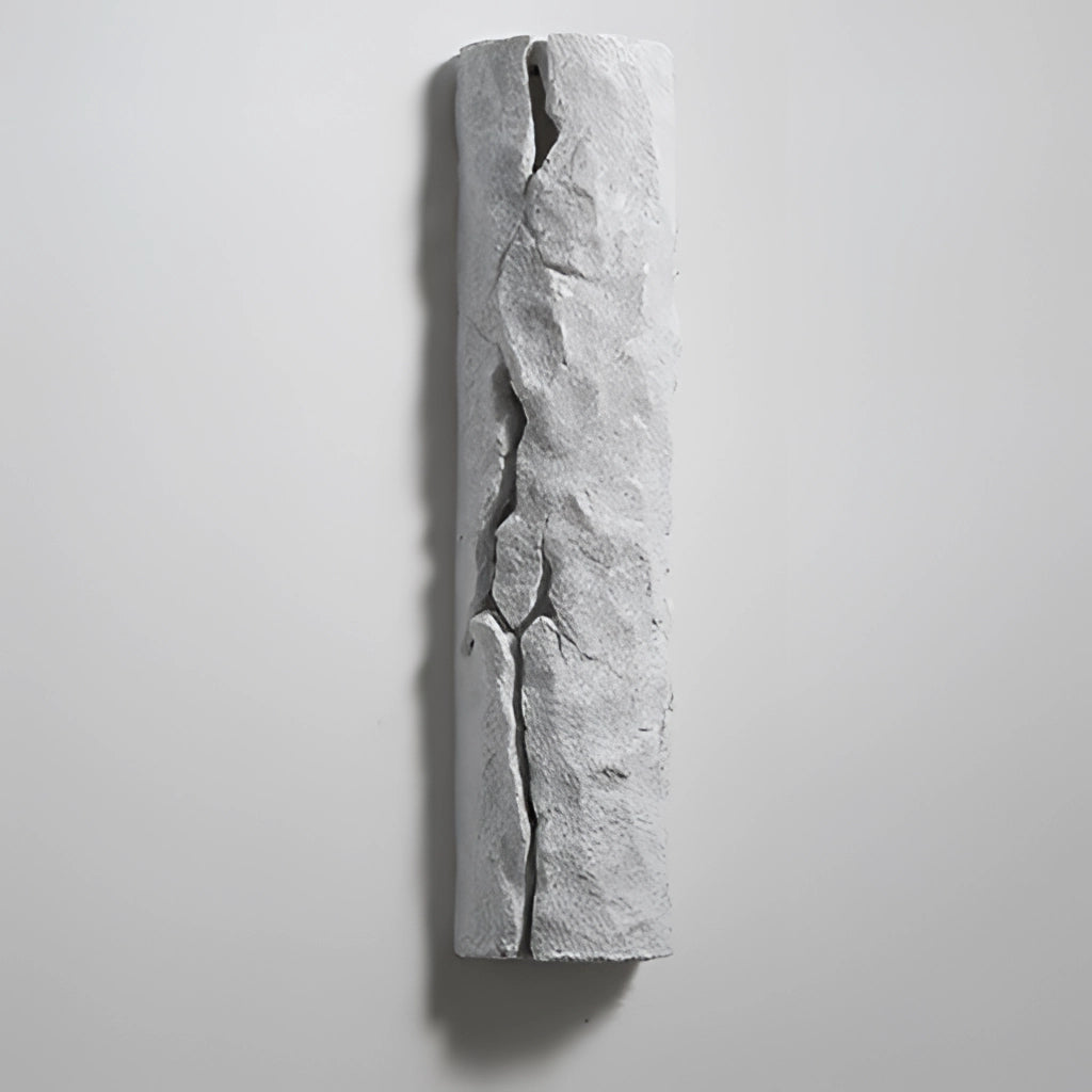 Outdoor wall light with IP65 waterproof rating, premium resin faux rock finish, rectangular shape with a sculptural design featuring wood and metal elements, glass cover.