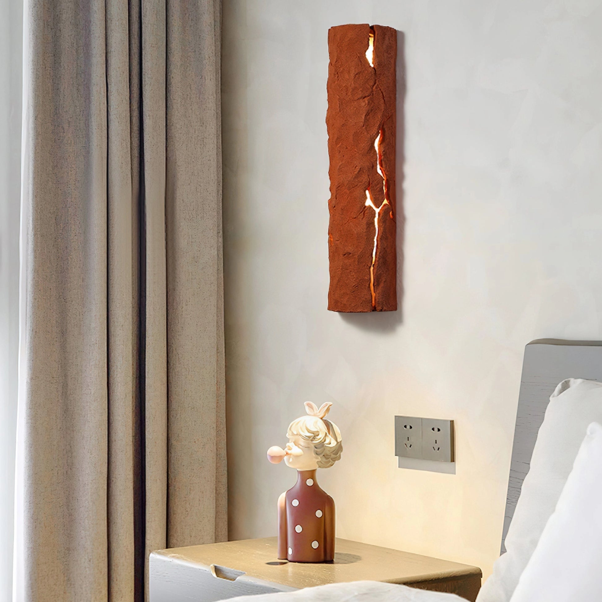 Outdoor wall light with IP65 waterproof rating and premium resin faux rock finish mounted on a wooden wall.