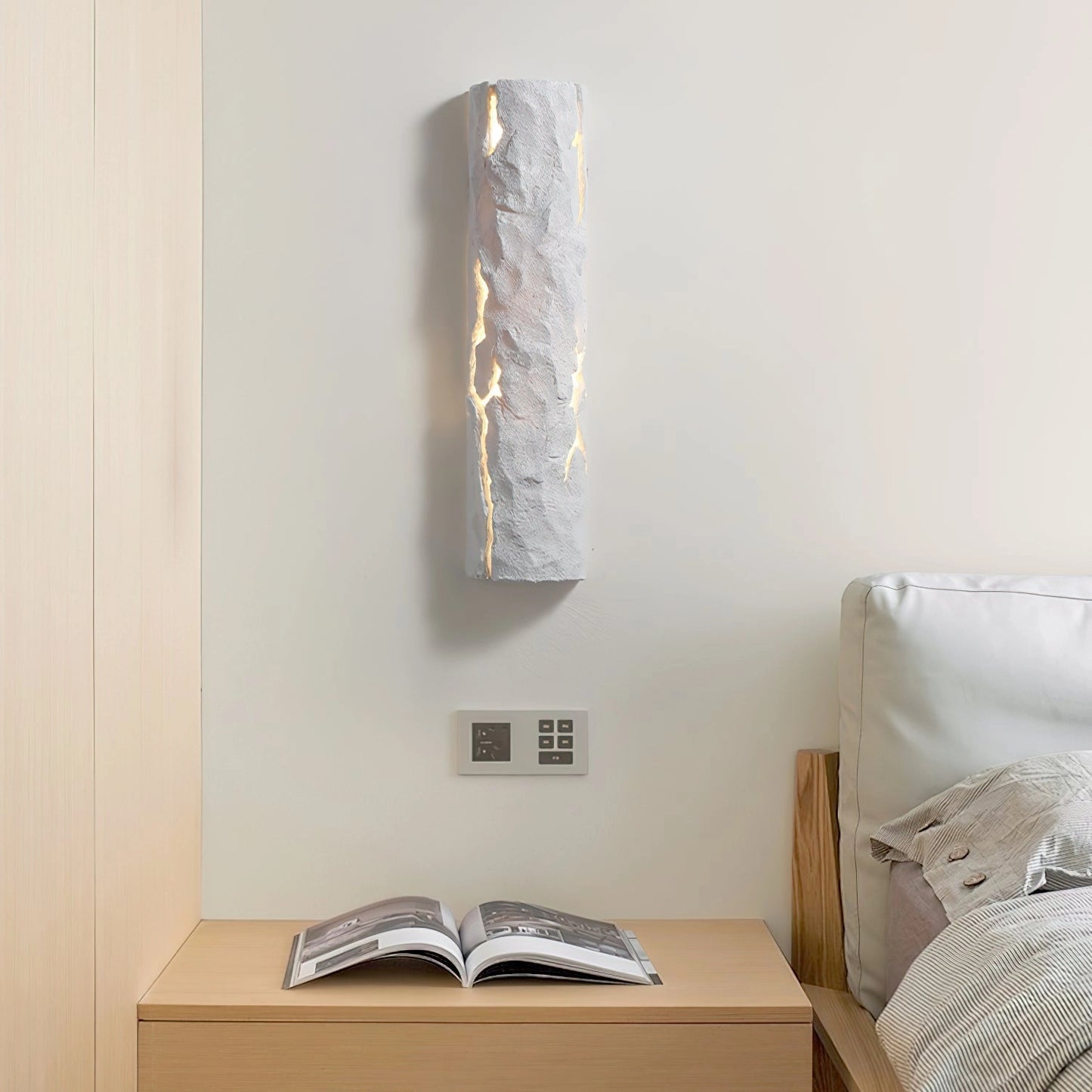 Outdoor wall light with IP65 waterproof rating and premium resin faux rock finish, mounted on a wooden wall background.