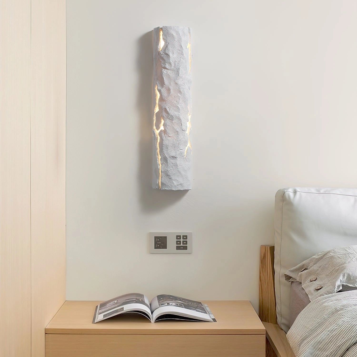 Outdoor wall light with IP65 waterproof rating and premium resin faux rock finish, mounted on a wooden wall background.