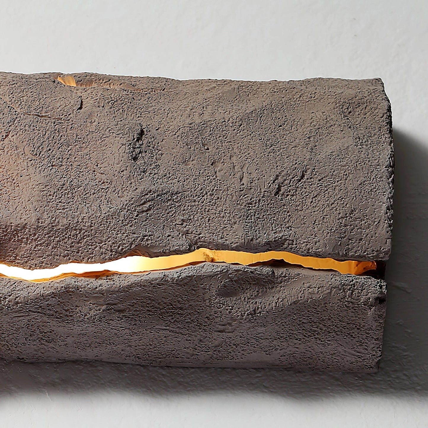 Outdoor wall light with IP65 waterproof rating, featuring a premium resin faux rock finish in brown, rectangular shape, and wood-like texture.
