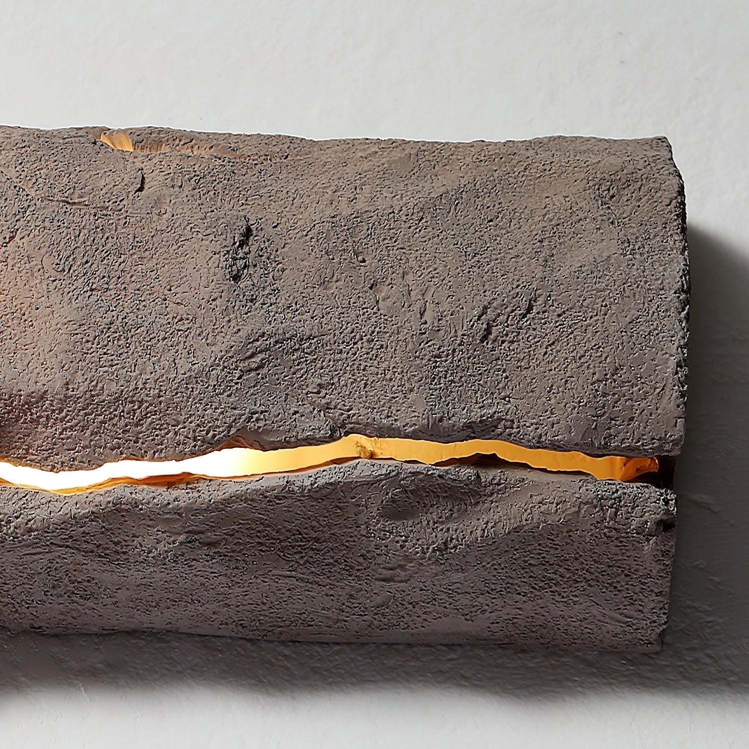 Outdoor wall light with IP65 waterproof rating, featuring a premium resin faux rock finish in brown, rectangular shape, and wood-like texture.