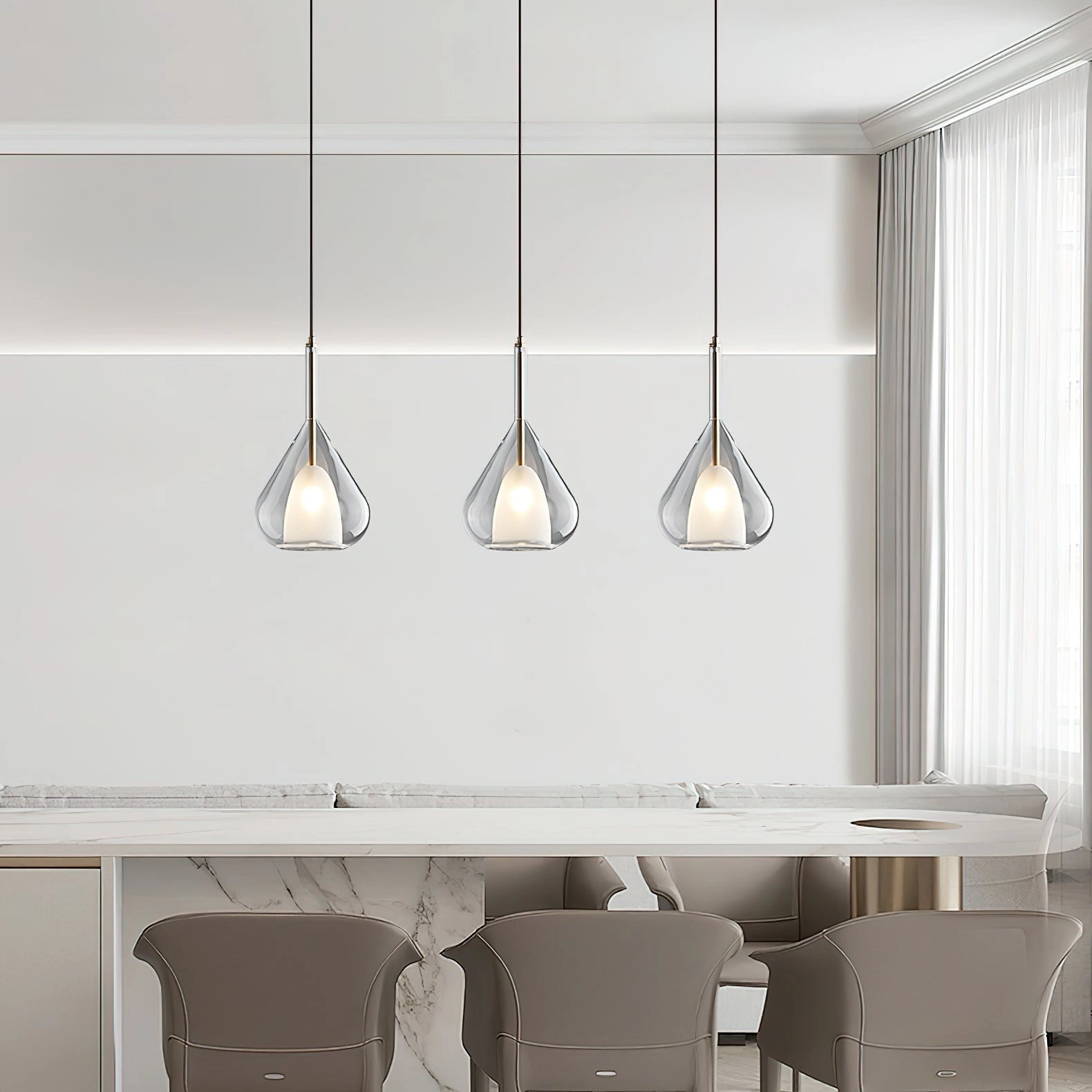 Nordic style pendant lamp with a clear raindrop design and starlight effect hanging in a modern interior featuring wooden furniture and grey cabinetry.