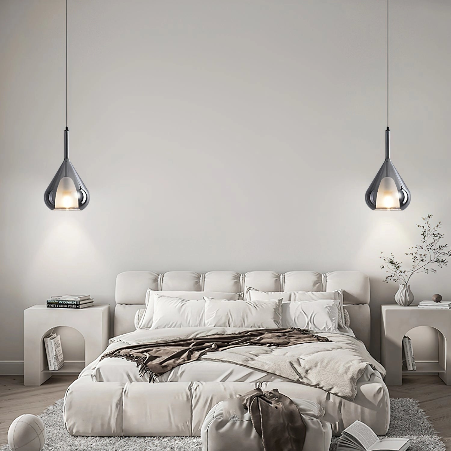Nordic style pendant lamp with clear raindrop design and starlight effect, hanging in a modern interior with white and black furniture, wood accents, and comfortable lighting.