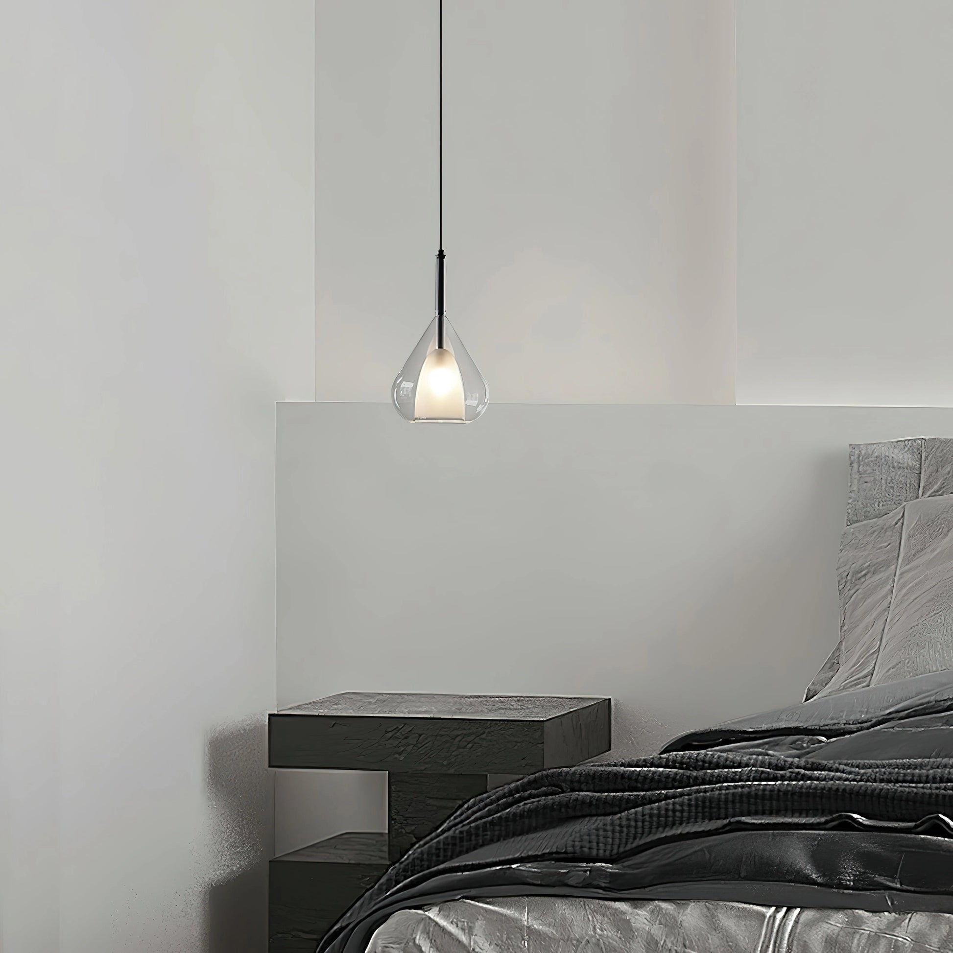 Nordic style pendant lamp with clear raindrop design and starlight effect, hanging in a modern room with grey walls and wooden flooring.