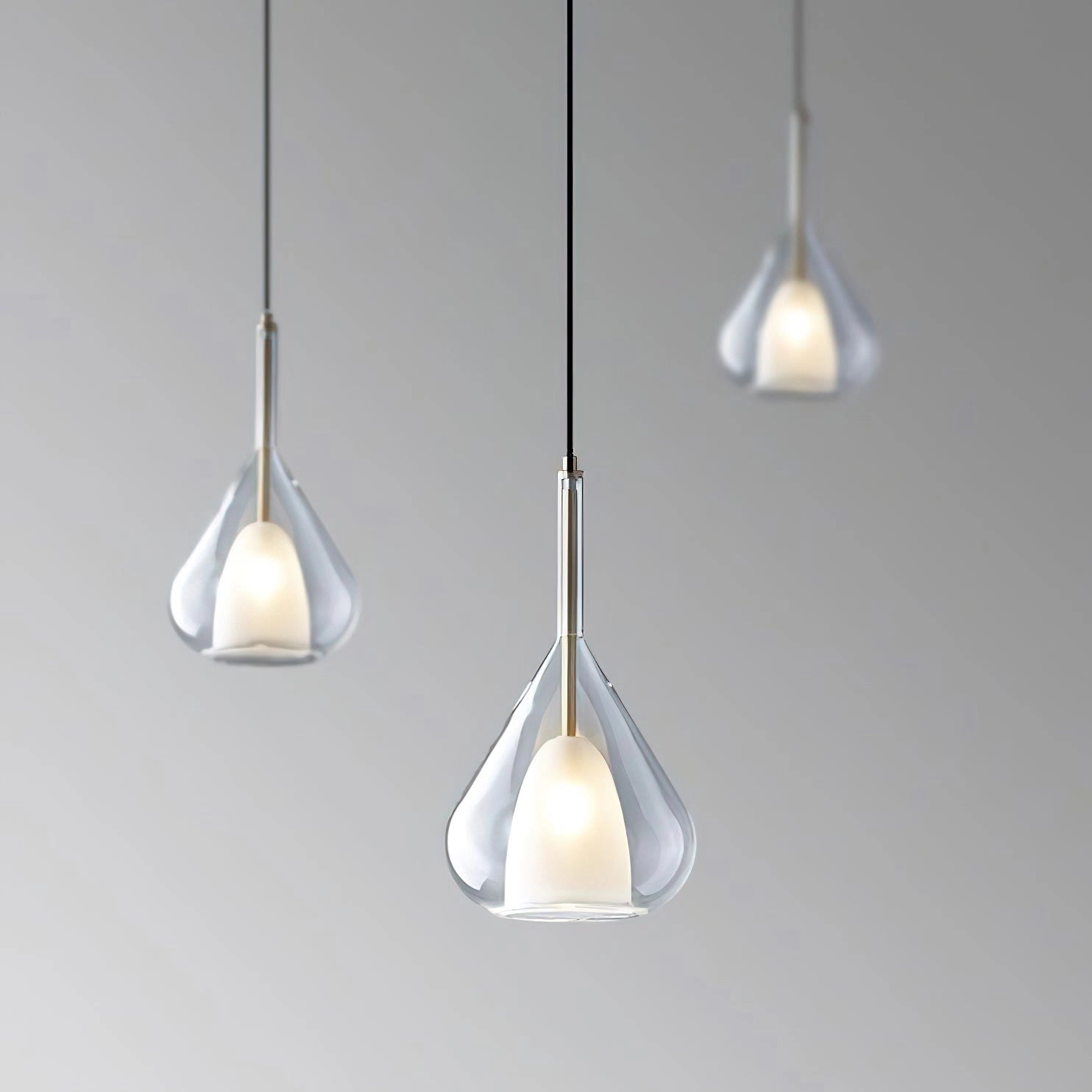 Nordic style pendant lamp with clear raindrop design and starlight effect, featuring a circular transparent glass shade and metal ceiling fixture.