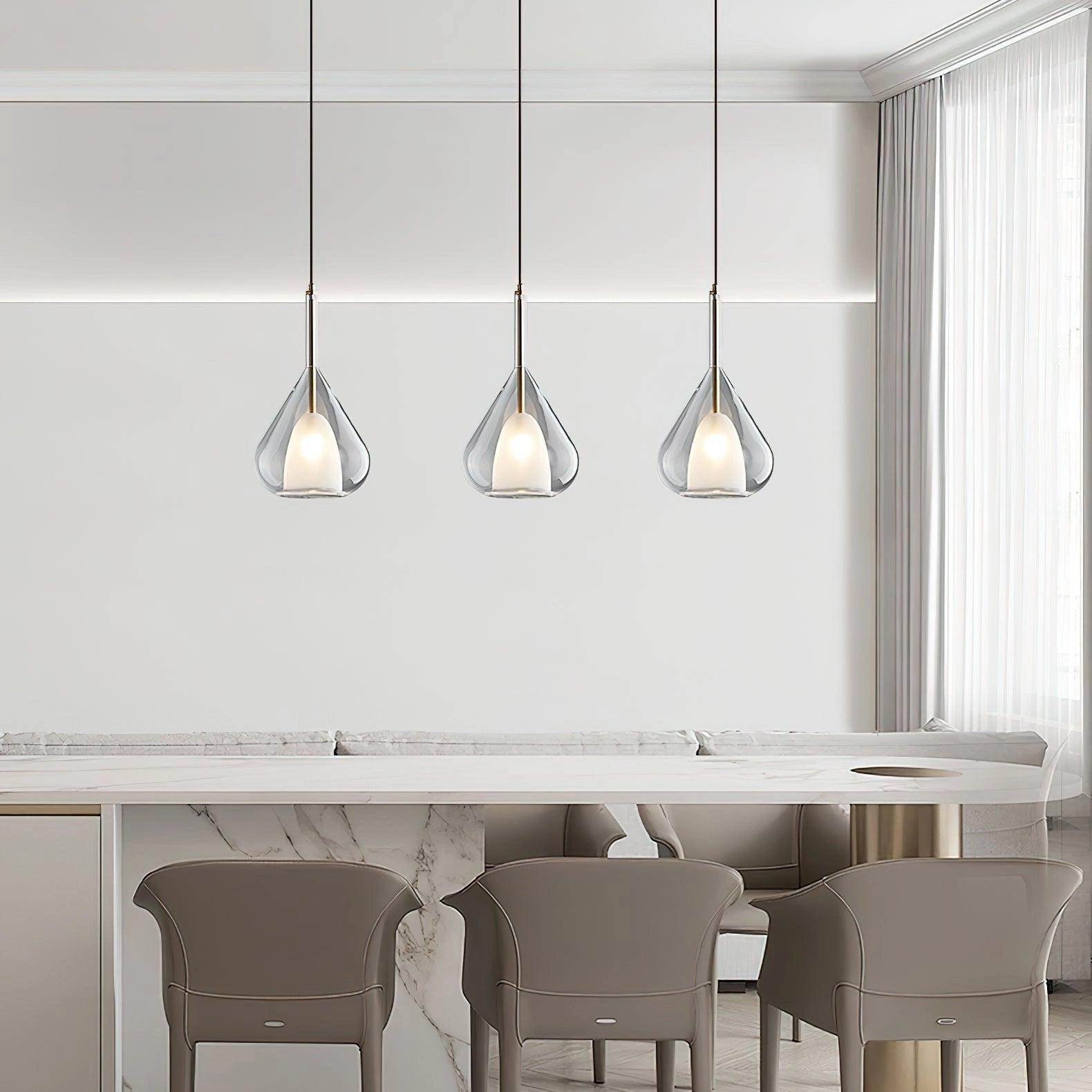 Nordic style pendant lamp with a clear raindrop design and starlight effect, hanging above a wooden table with white chairs in a modern interior setting.