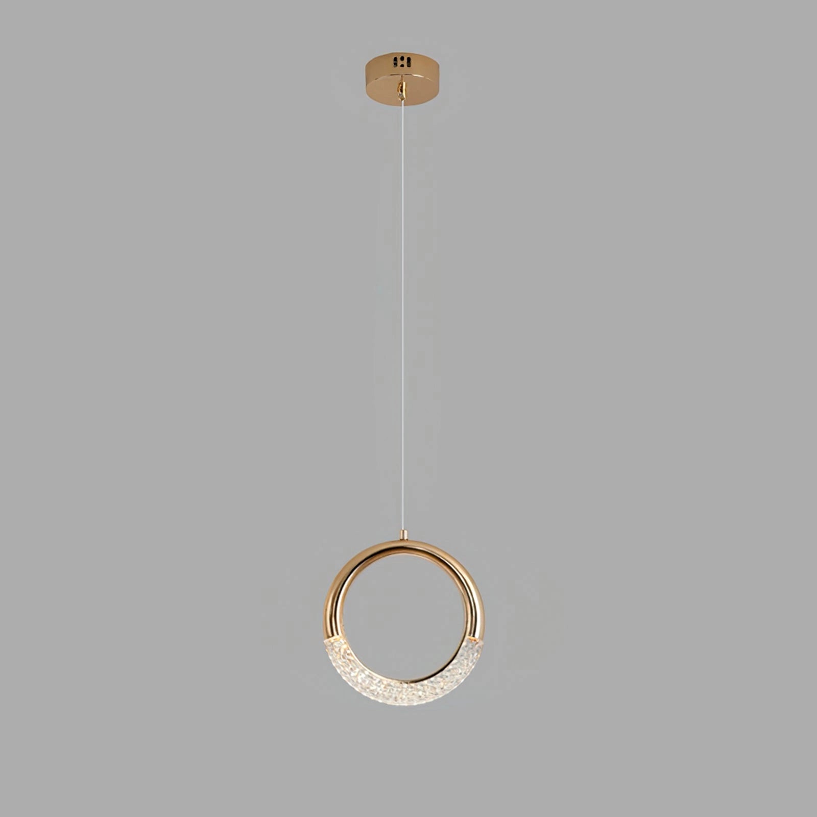 Modern gold pendant lamp chandelier with multiple circular heads, suspended from the ceiling, emitting cool light.