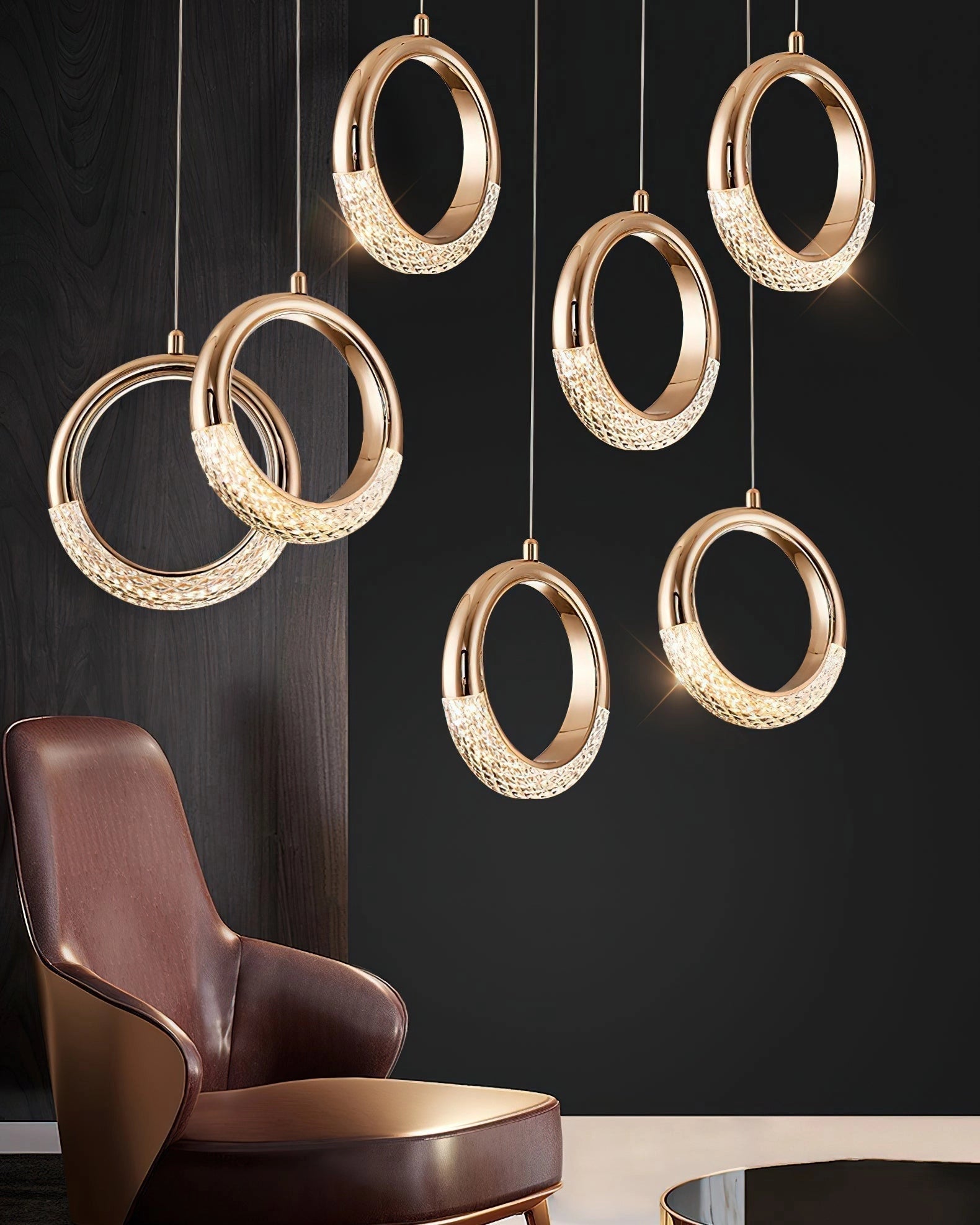 Modern Pendant Lamp Dante with gold accents, hanging above a brown couch. The fixture features a rectangular wooden design.
