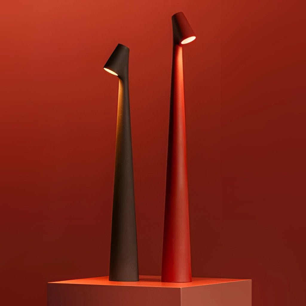 Portable rechargeable LED table lamp with aluminum construction and three light intensities, displayed on a wooden surface.
