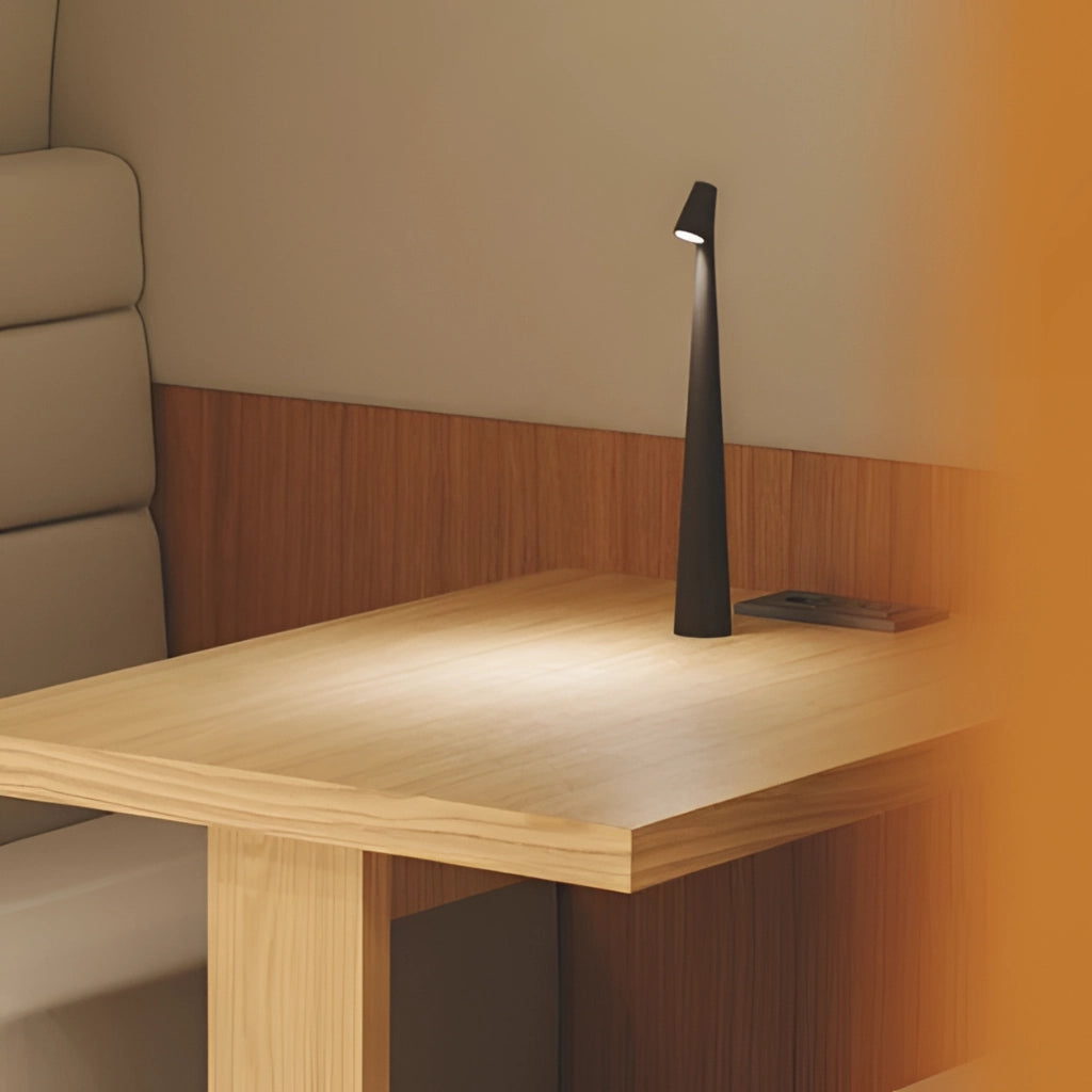 Portable rechargeable LED table lamp made of aluminum, placed on a wooden table, showcasing three different light intensities.