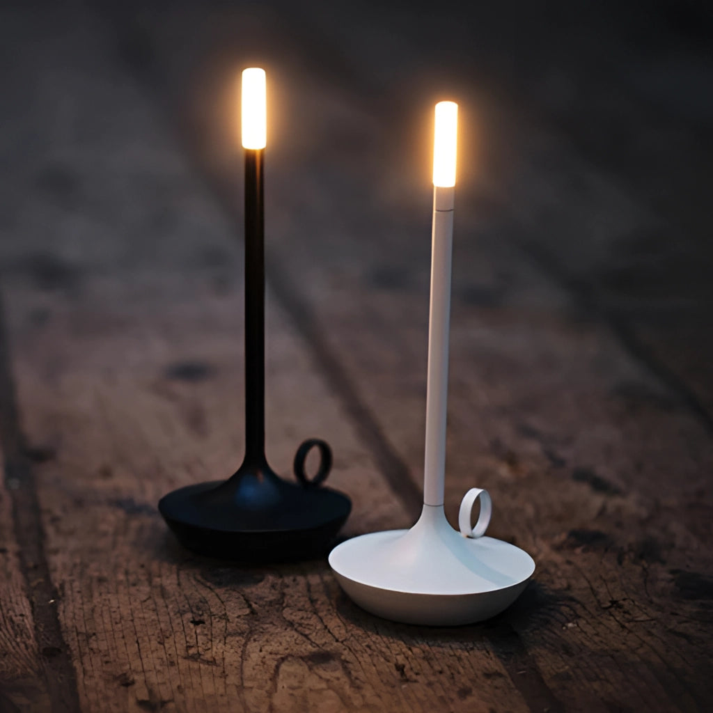 Nordic candlestick light with adjustable dimming, rechargeable, aluminum casing, emits warm light, standing on a wooden surface.
