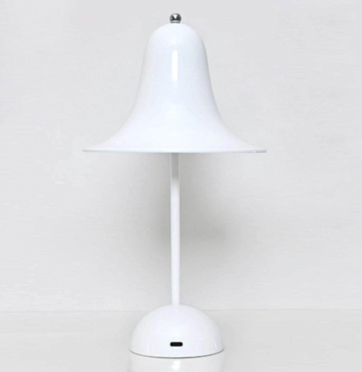 Rechargeable LED lamp with touch sensor, featuring a wooden base and a sleek lampshade, placed on a table.